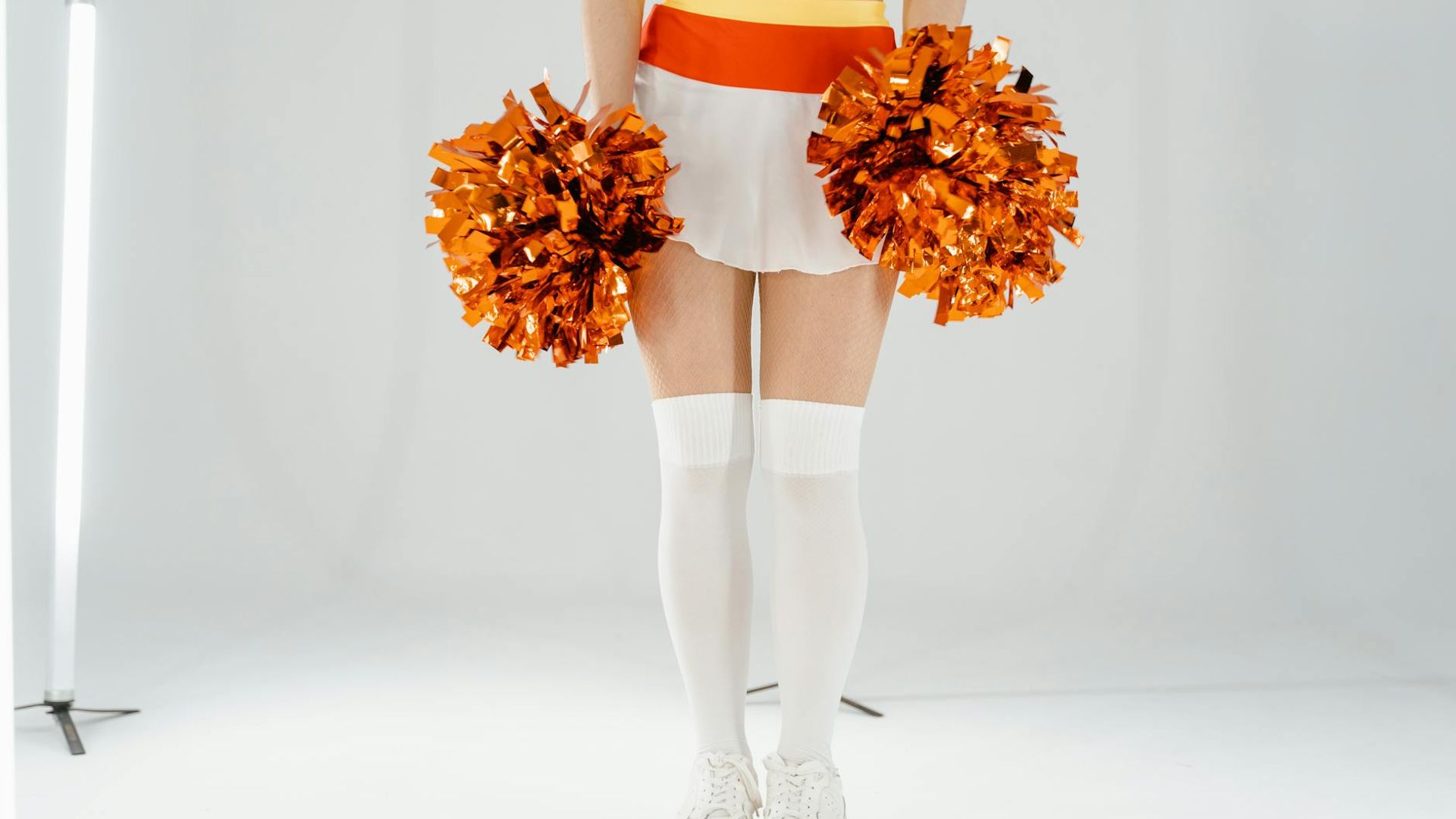 Person performing dynamic exercises in a modern bright studio